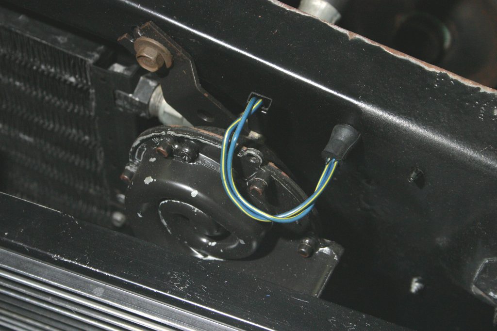 car horn installed on radiator support of an old car