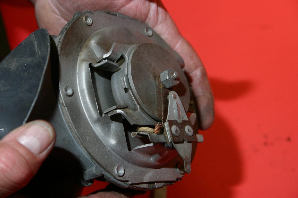 a car horn with housing cover removed