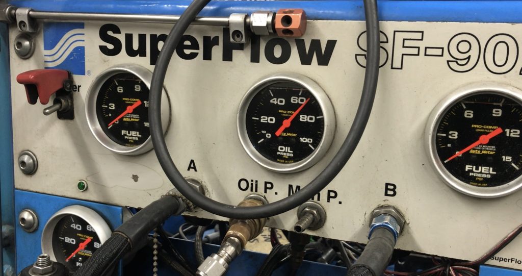 Oil pressure gauge on an engine dyno run panel