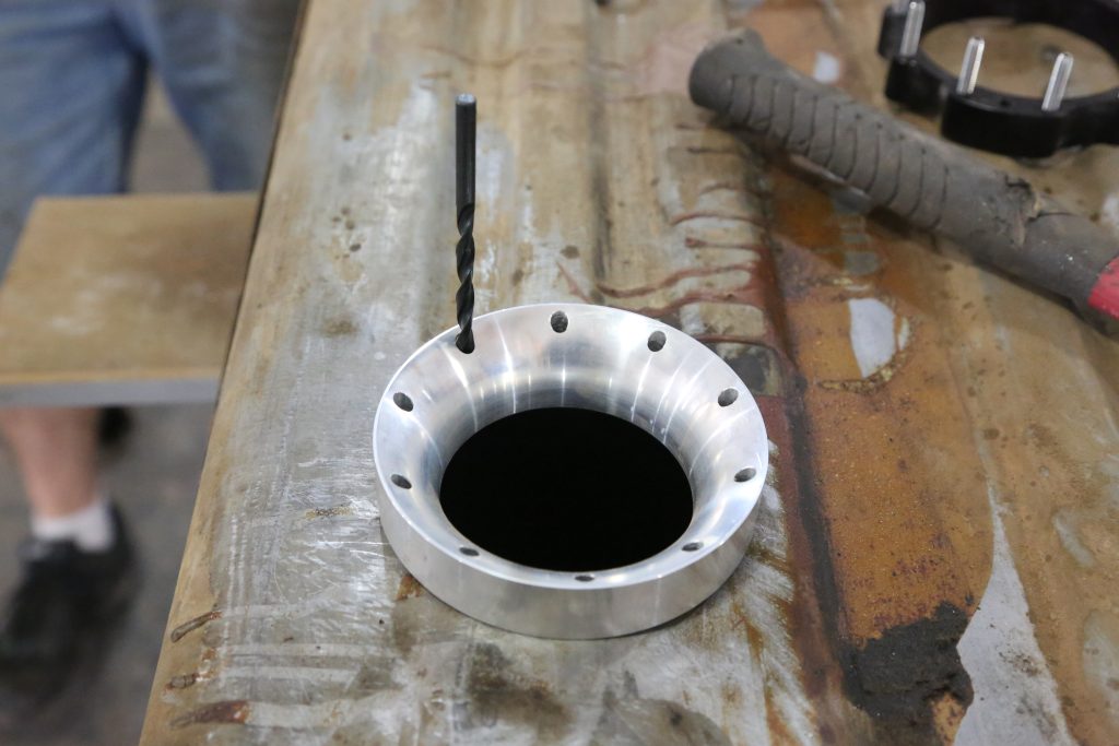 Drilling template on a fuel tank for pump retrofit