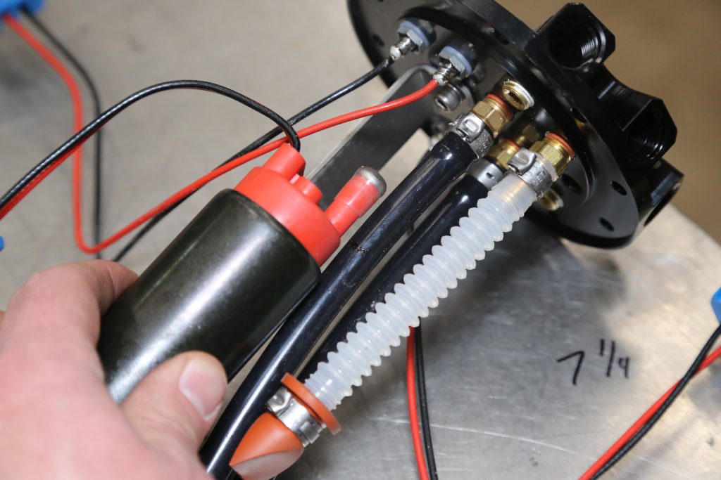 Installing a fuel pump into a drop-in tank assembly