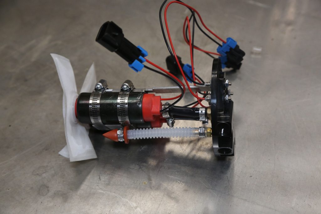 an in-tank electric fuel pump on workbench