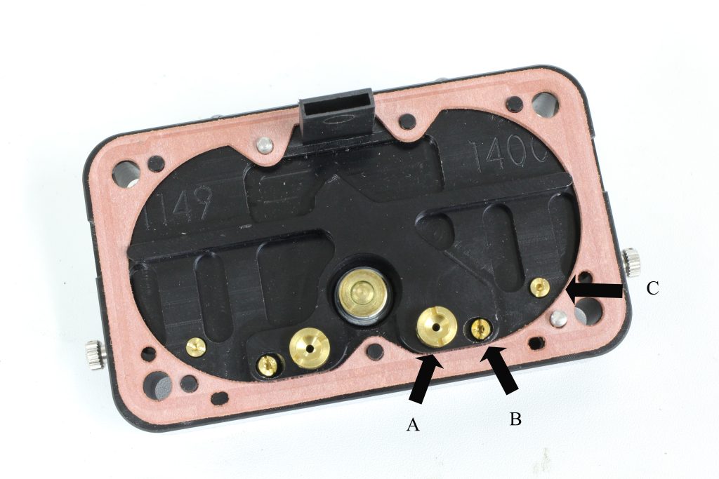 backside of a Edelbrock VRS-4150 carburetor metering block
