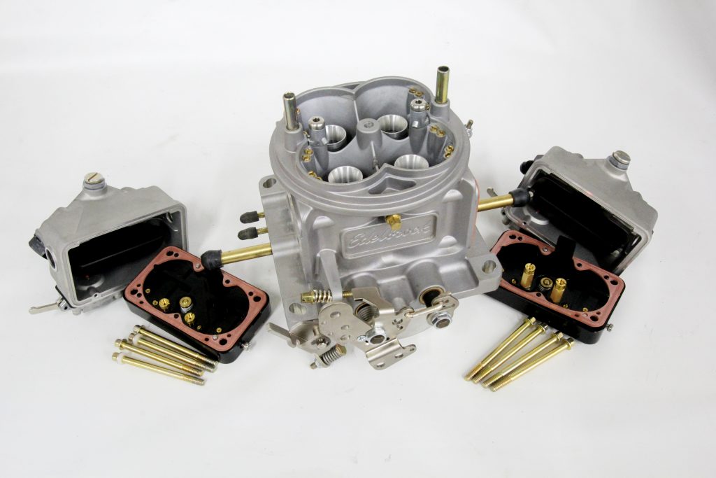 disassembled Edelbrock VRS-4150 carburetor on table
