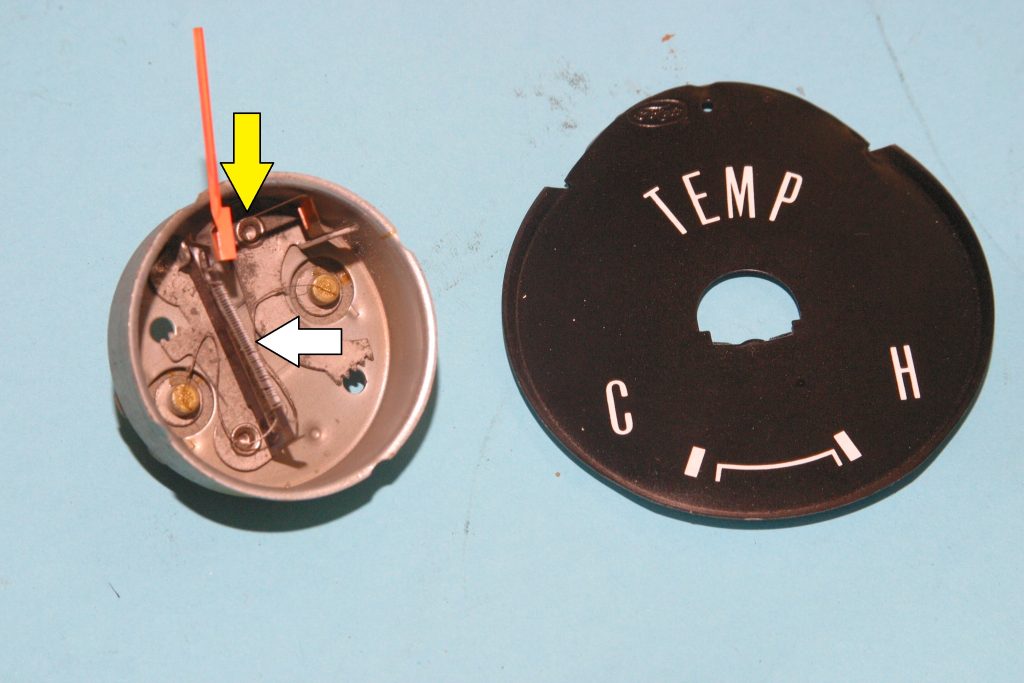 dissembled vintage automobile temperature gauge