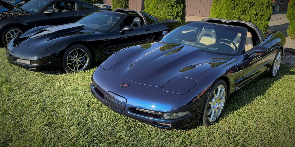 a pair of chevy corvette c5 coupes