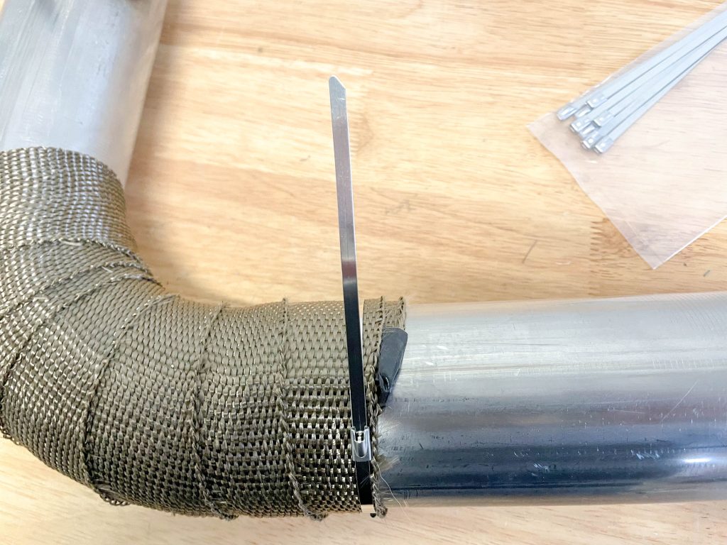 wrapping a lock tie around a heat shield wrap