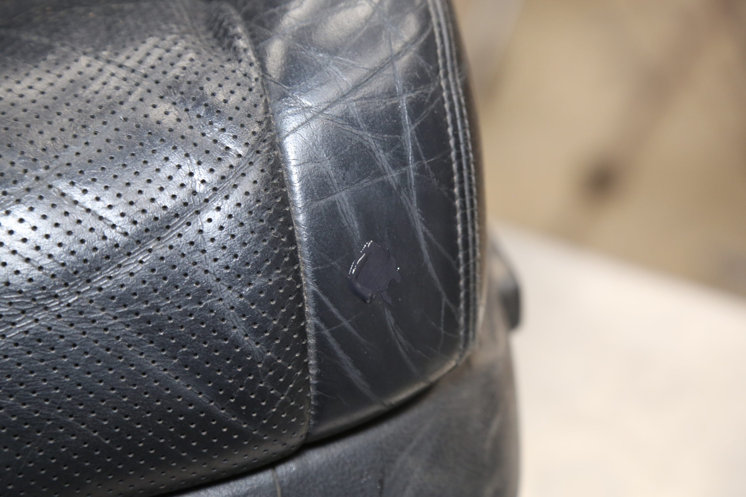 Tear in vinyl part of leather seat - Anyway to know what that *should* do  to Guaranteed Trade In value?