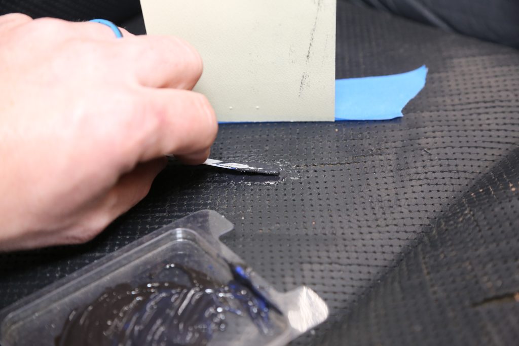 putting epoxy over a glued hole in a car seat