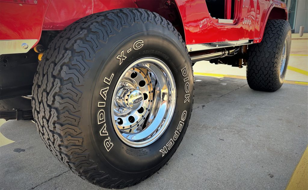 close up of cepek tires on cragar rims on a jeep cj-5