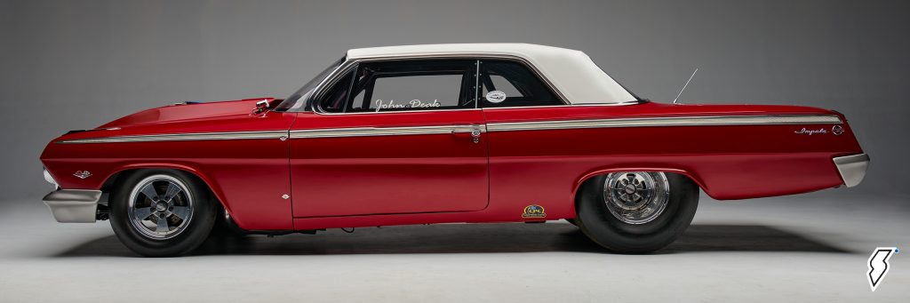 side profile view of a 1962 chevy impala drag race car