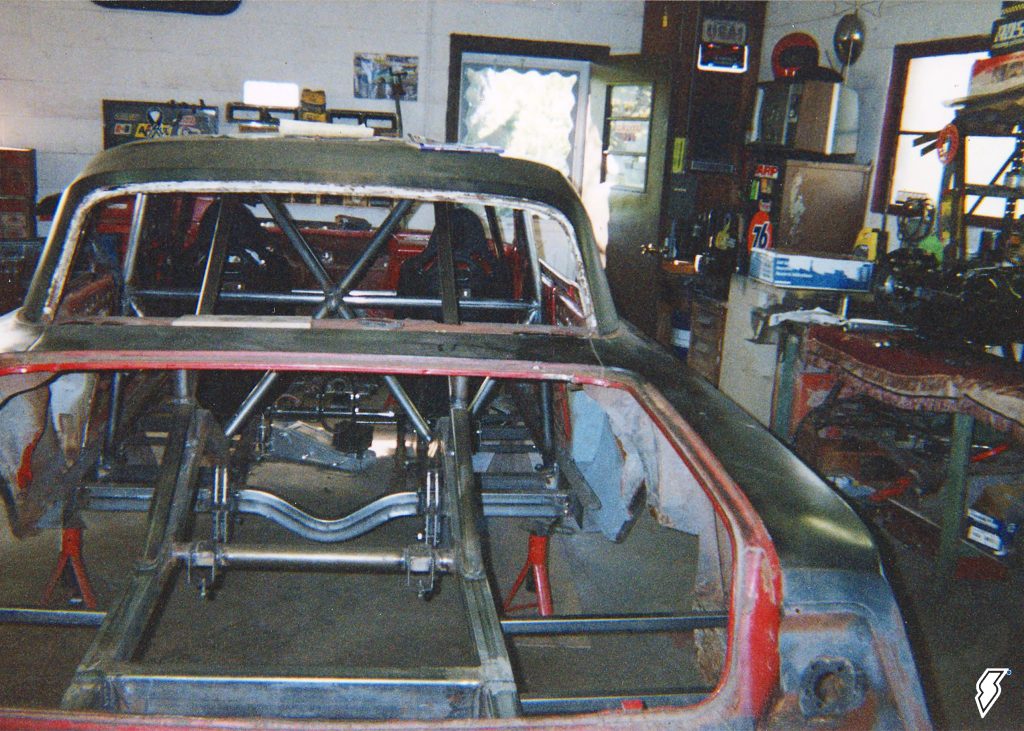 1962 impala race car project in a garage shop