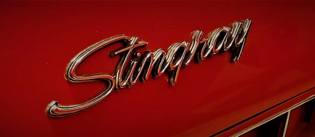 Stingray emblem on the fender of a red 1972 Corvette