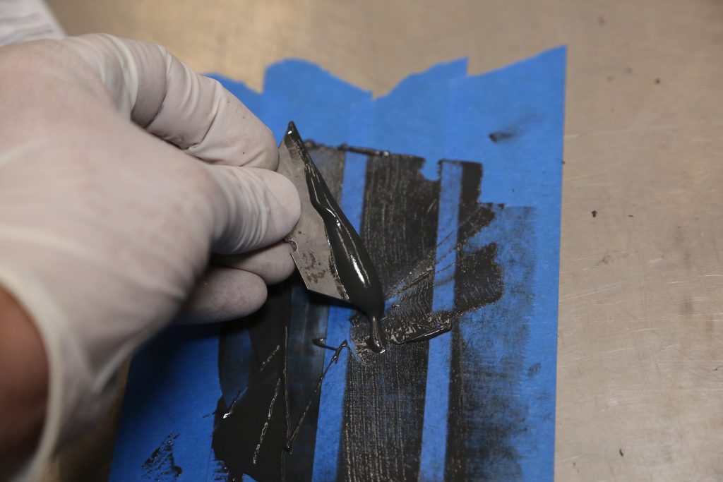 JB weld epoxy on a razor blade
