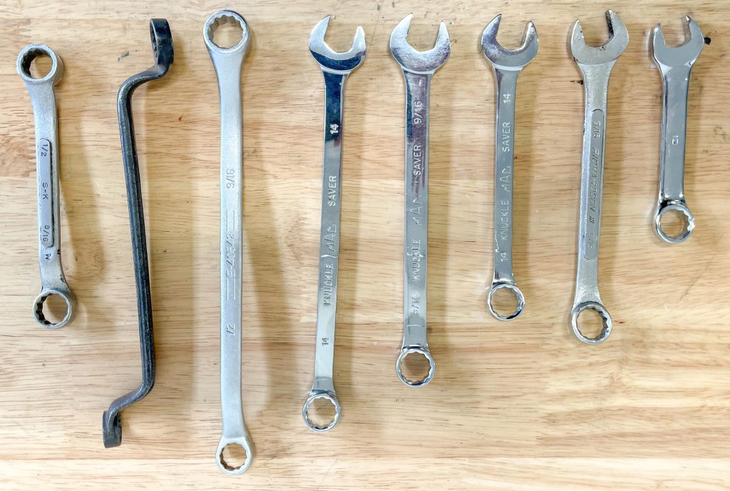 Assortment of box wrenches on a workbench