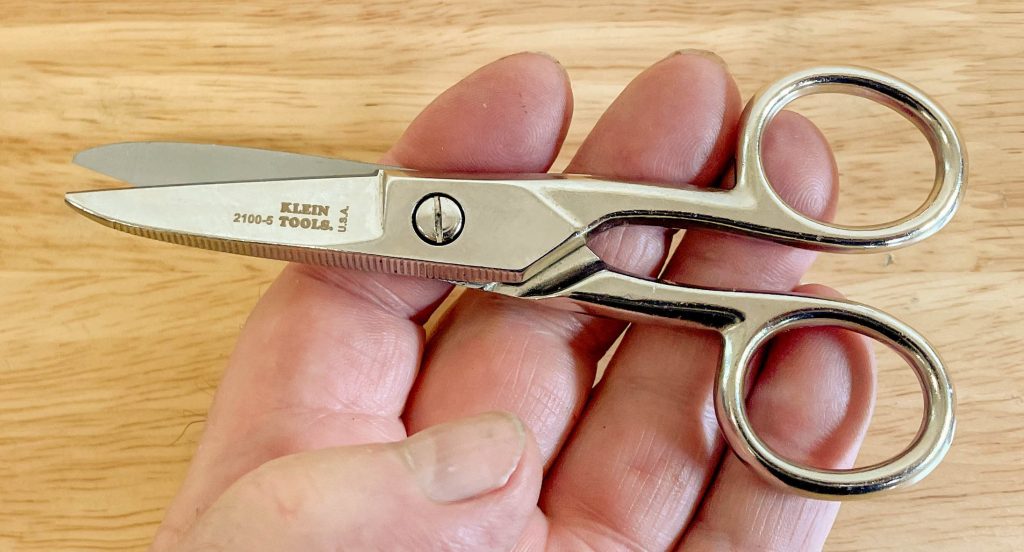 man holding a pair of scissors