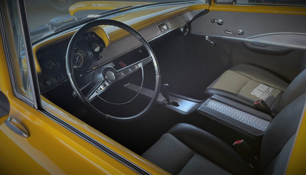 interior steering wheel and dash view of Project X 1957 chevy 210