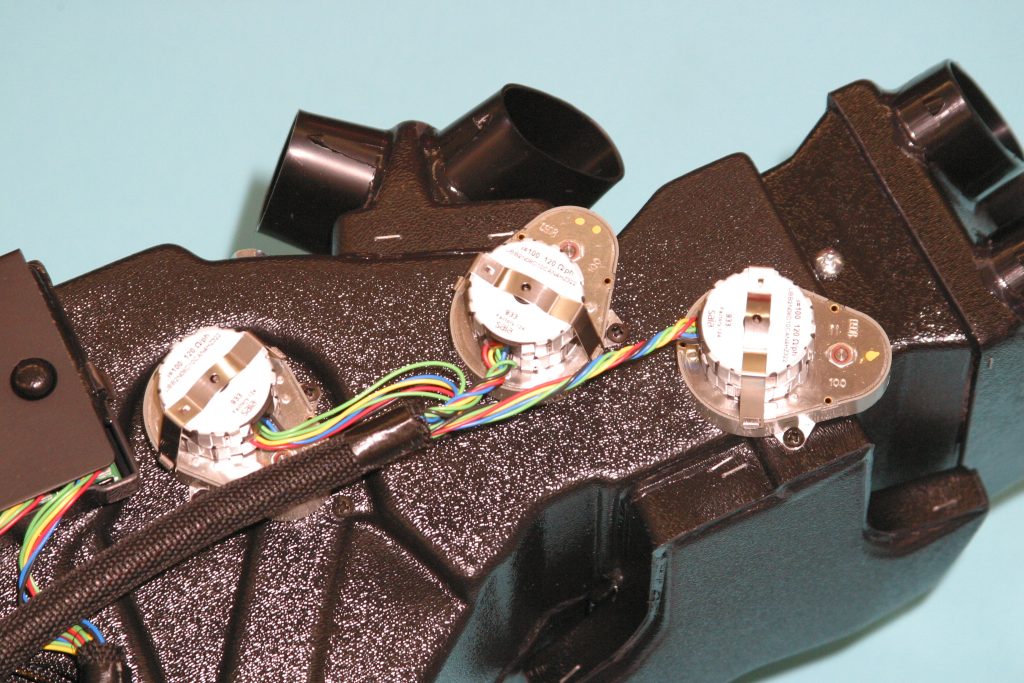 rear view of electric motors on a vintage air A/C surefit kit