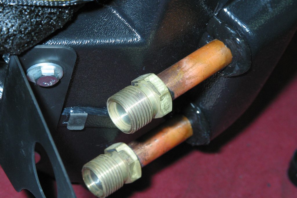 close up of automotive a/c heater hose connections