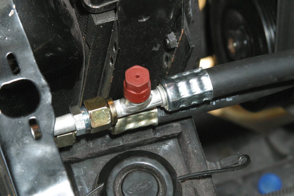 pressure release fitting on automotive A/C line