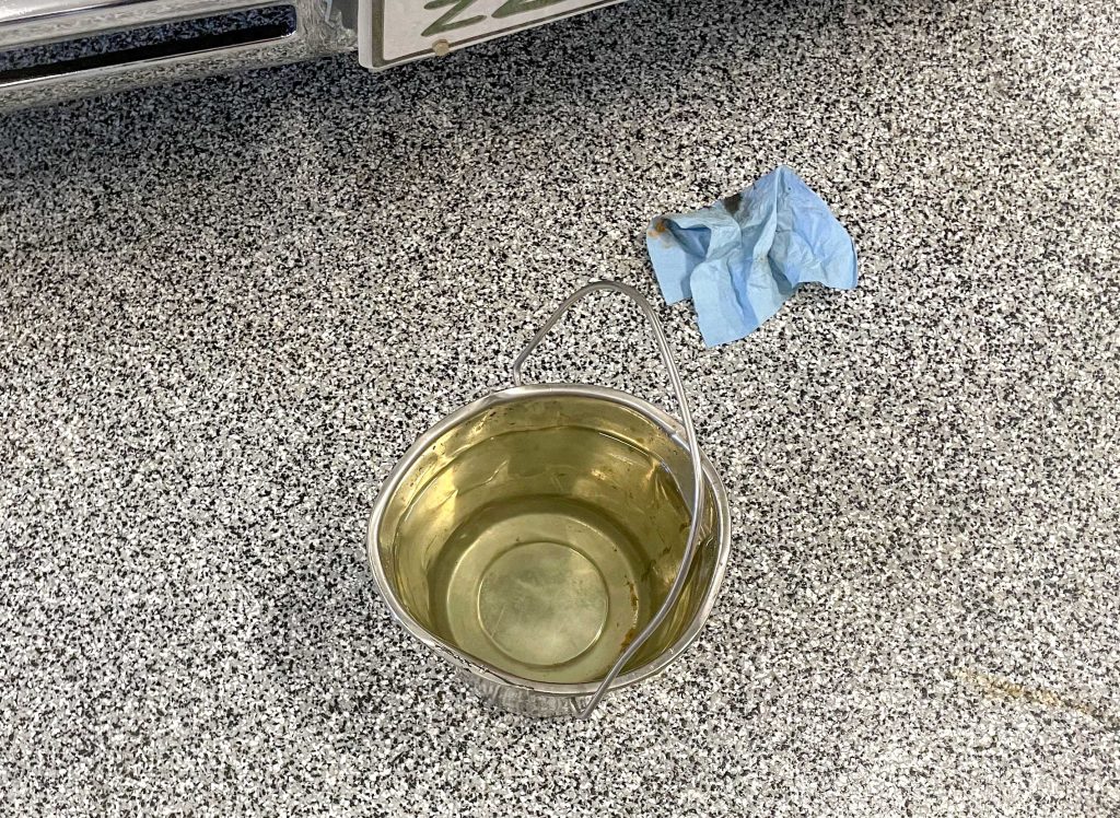 pail of water on a garage floor