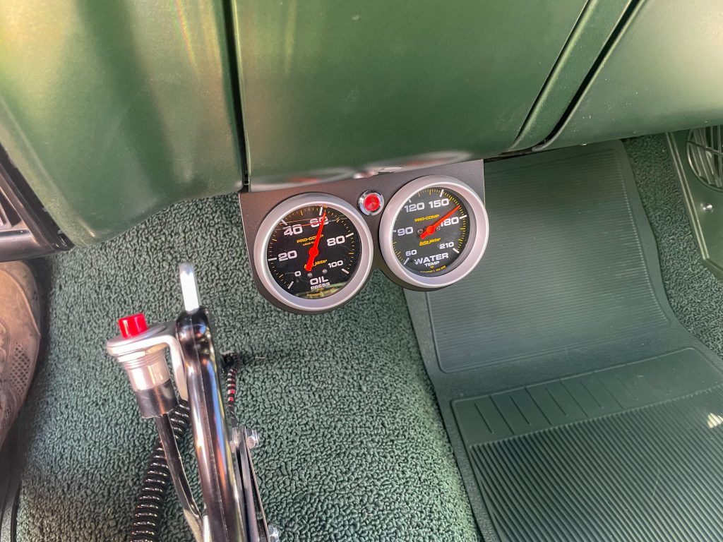 oil pressure and water temperature gauges in an old muscle car