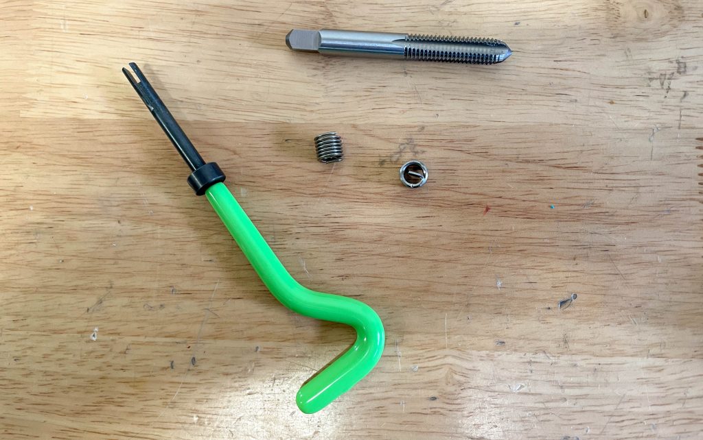 thread tap & repair tool on a workbench