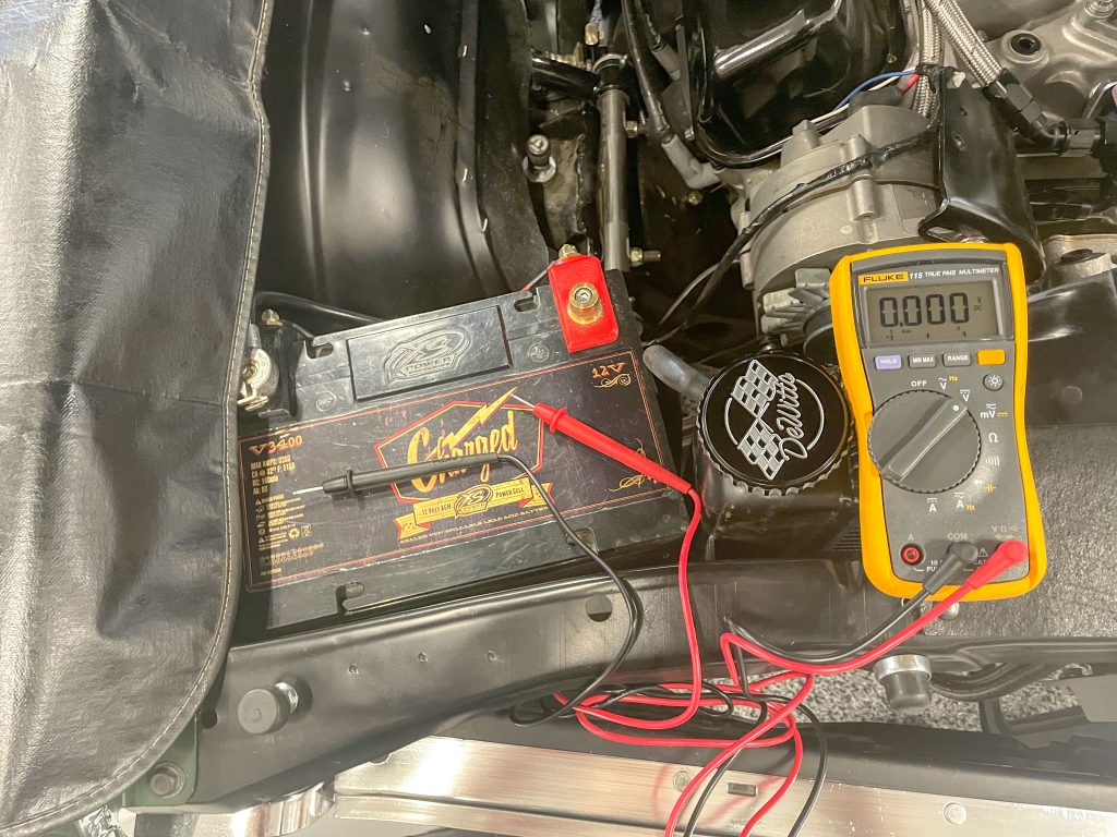 checking vehicle battery charge with a multimeter tool