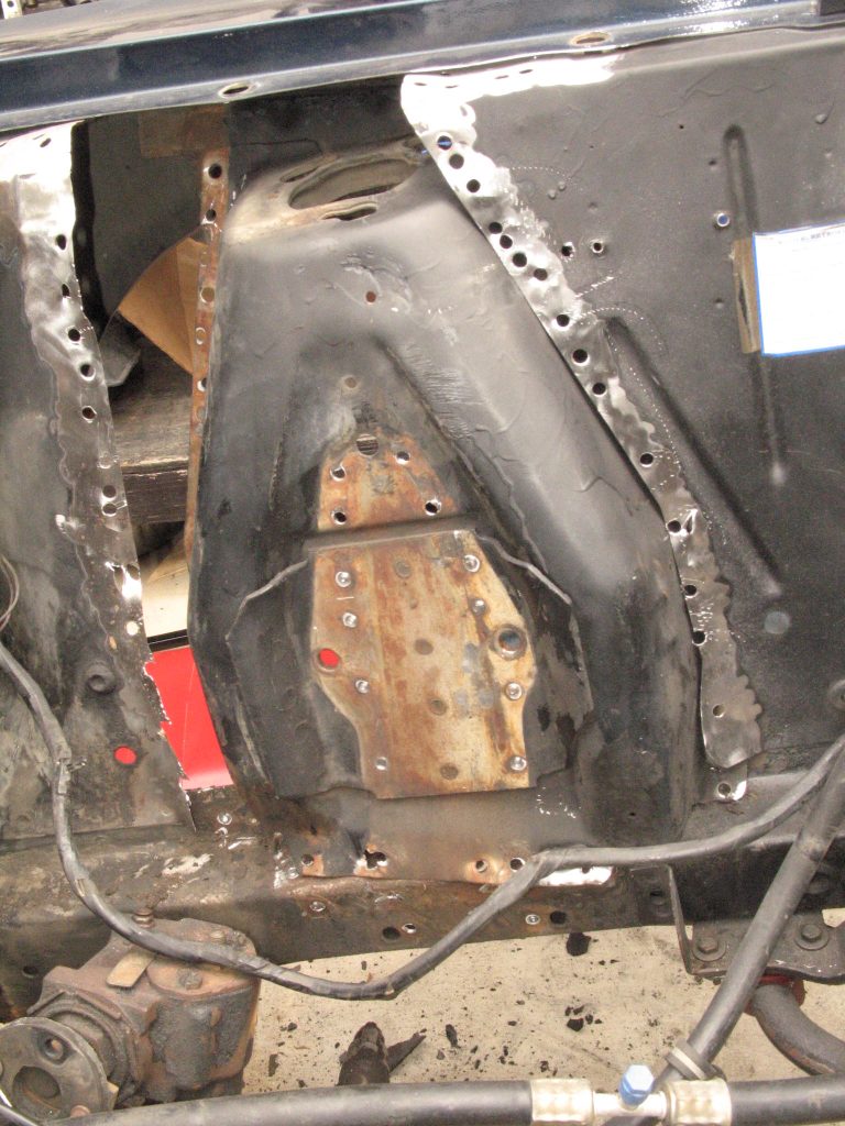 a shock tower partially removed from a ford mustang