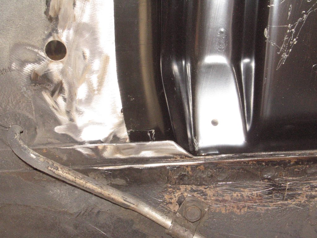 close up of metal inside a mustang fender