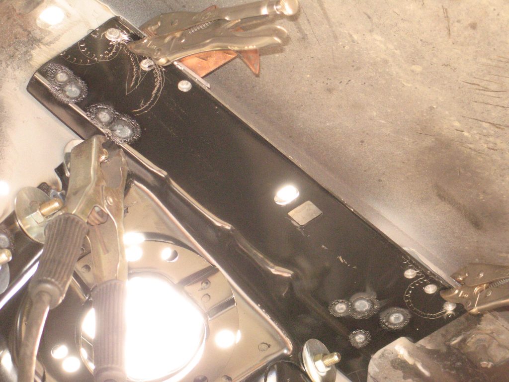 bracket being held in place by clamps in a ford mustang