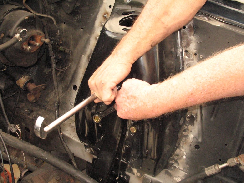 tightening bolts in a ford mustang shock tower replacement