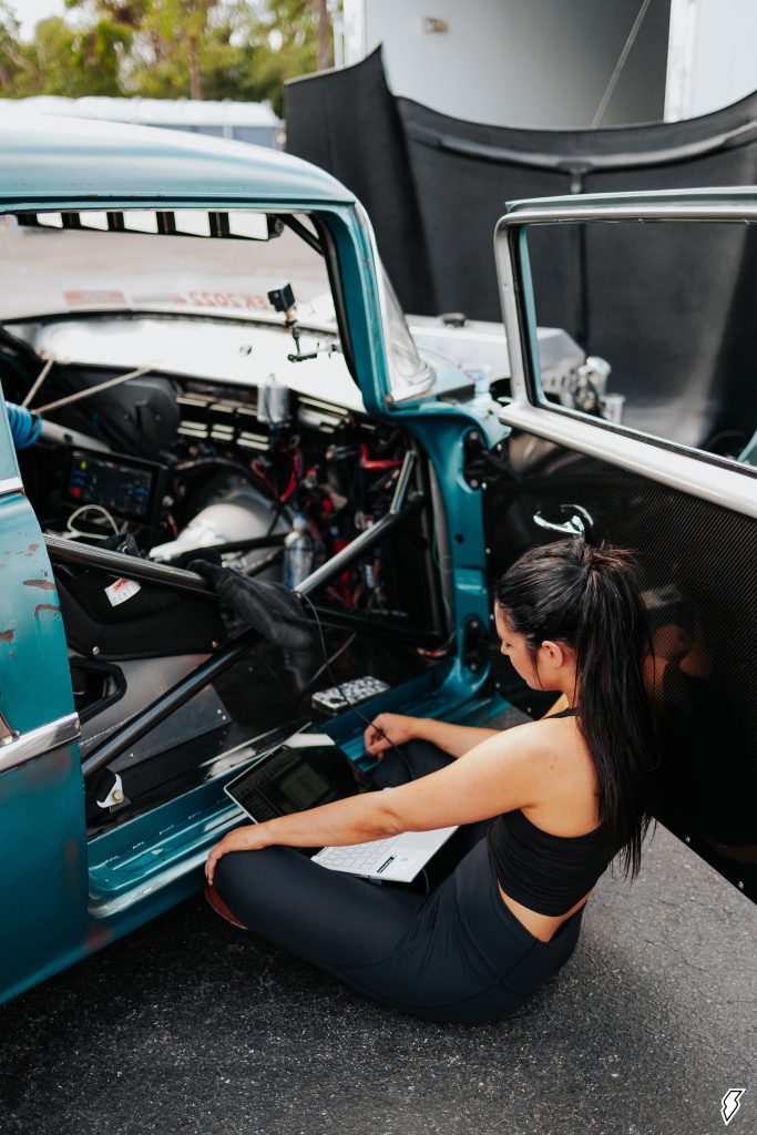 alex taylor with laptop tuning 1955 chevy drag car