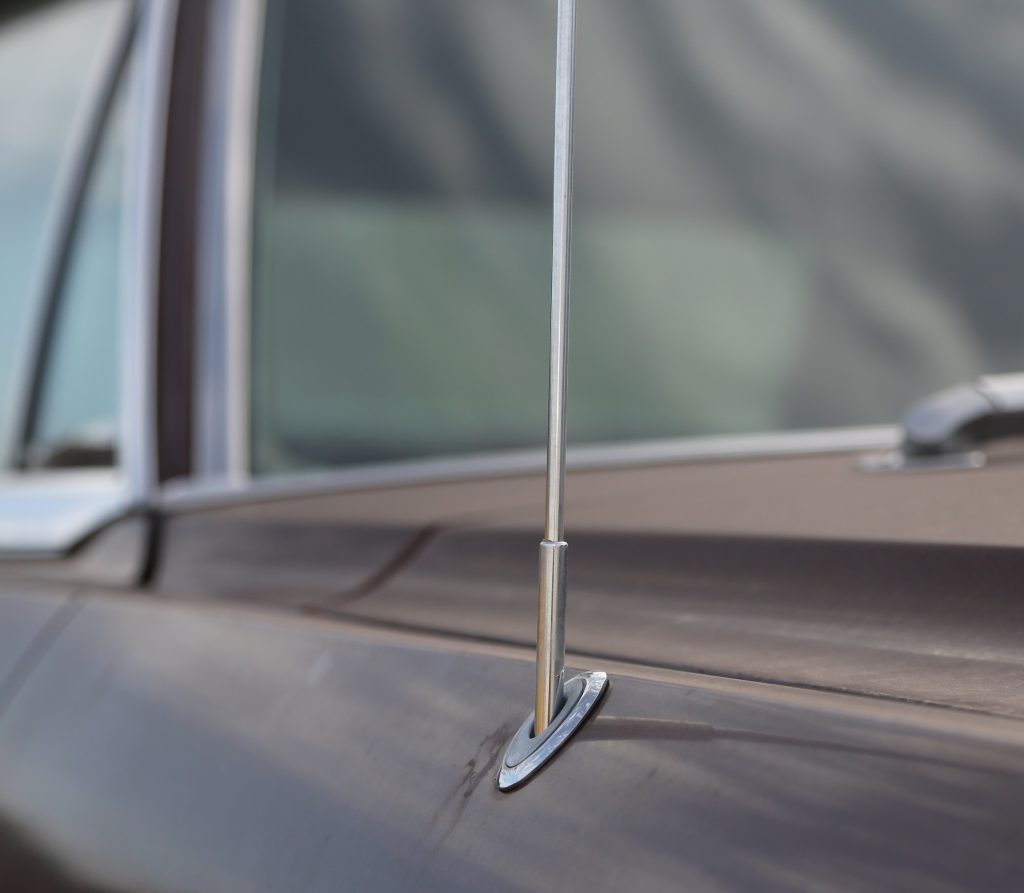 close up of a car radio antenna base