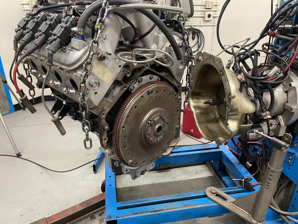 rear view of an engine getting installed on a dyno