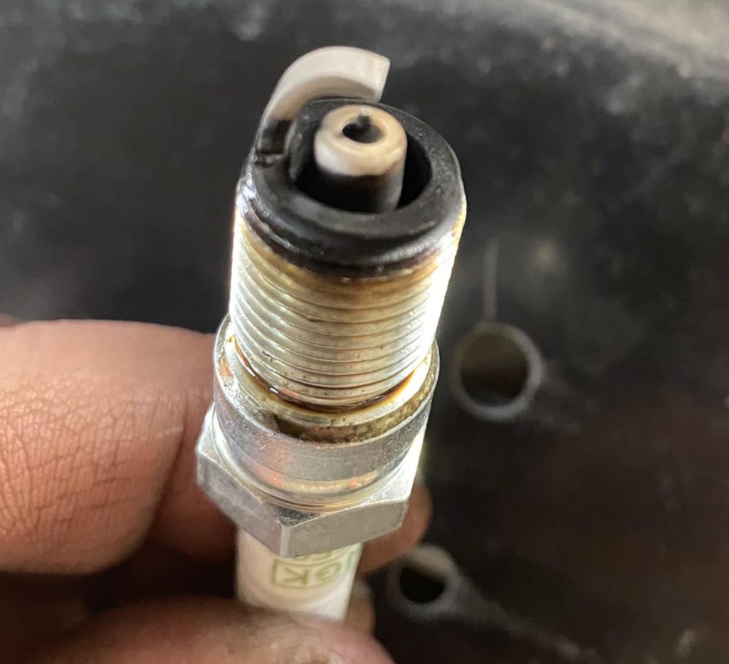 tip of an old dirty used spark plug
