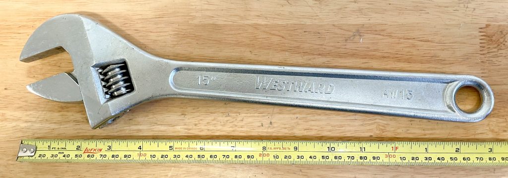 measuring tape with an adjustable wrench