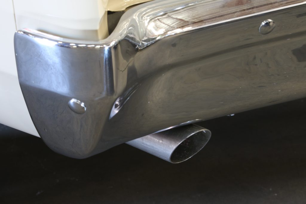 an exhaust tip on a classic muscle car