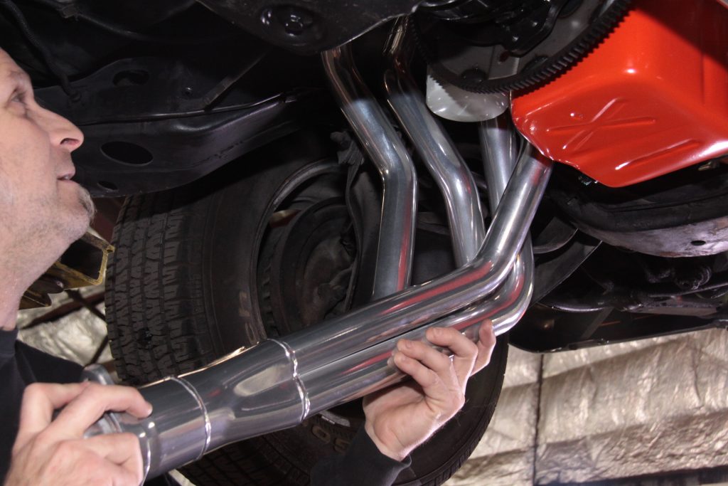 fitting exhaust headers under engine bay of a classic car