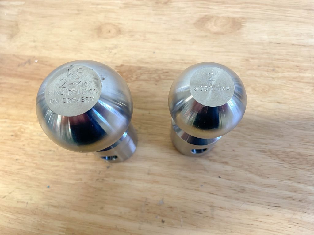 a pair of hitch balls on a table