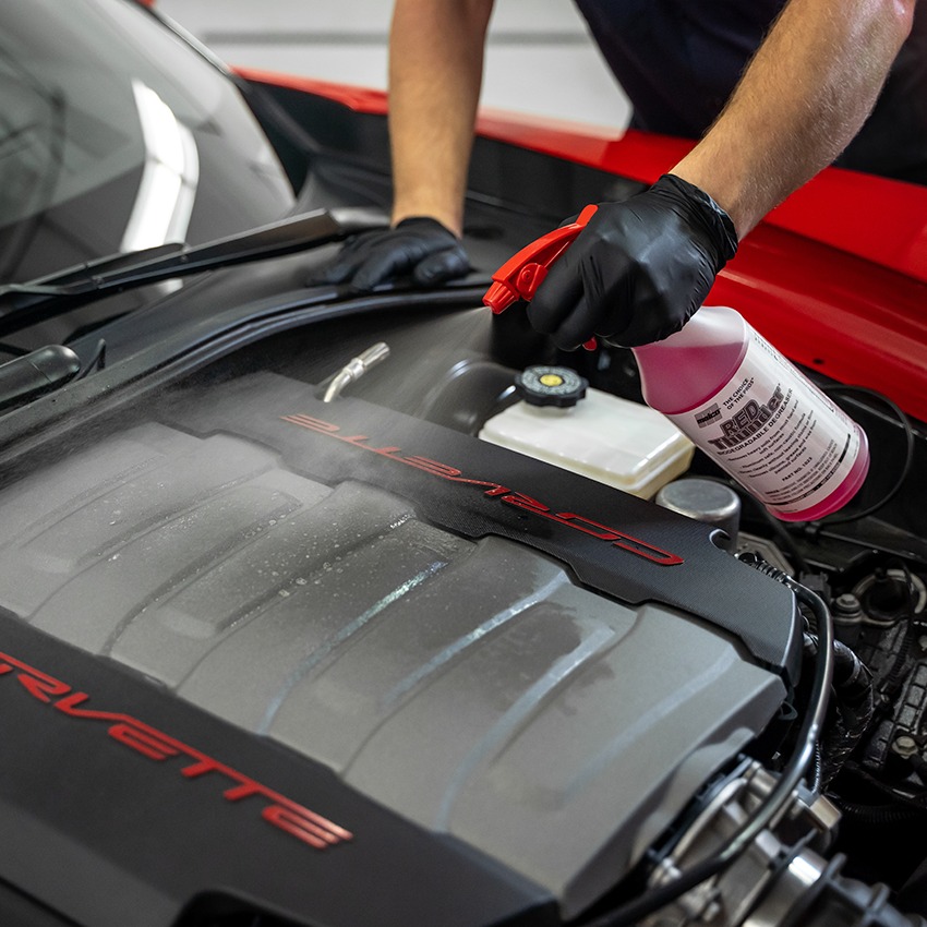 malco red thunder degreaser being sprayed onto a corvette engine