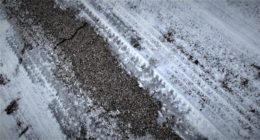 close up of tire tread in snow during winter