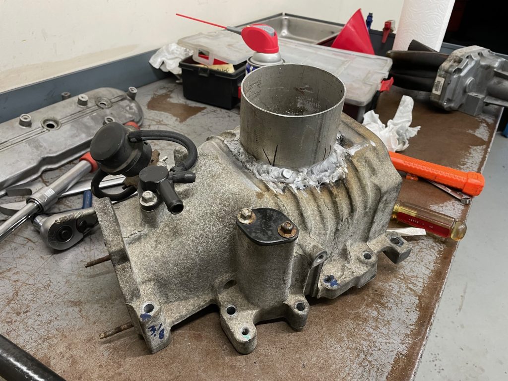 Supercharger housing with carburetor adapter