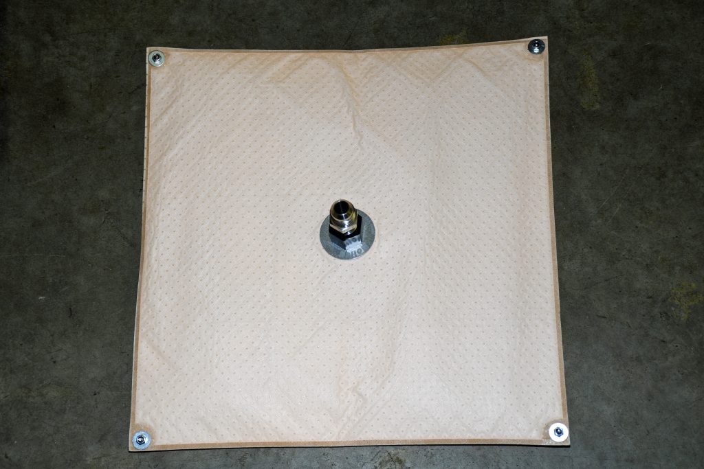 absorbent fuel mat for a fuel system tank