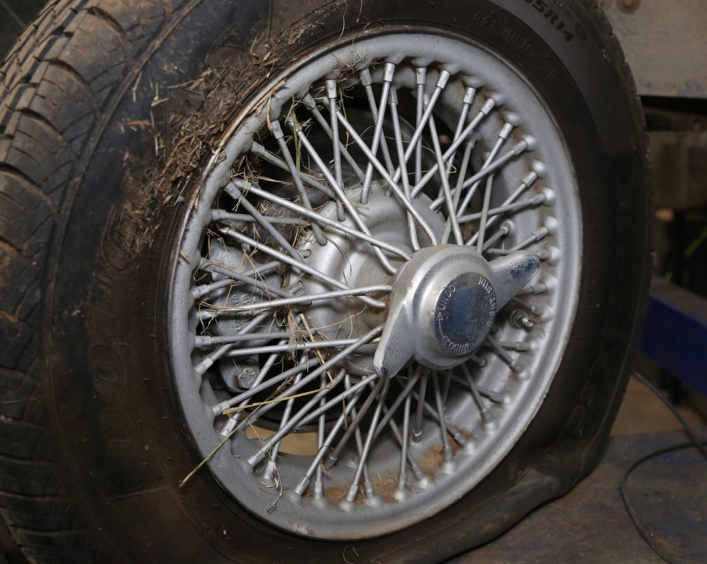 close up of a knock-off wheel on a vintage car