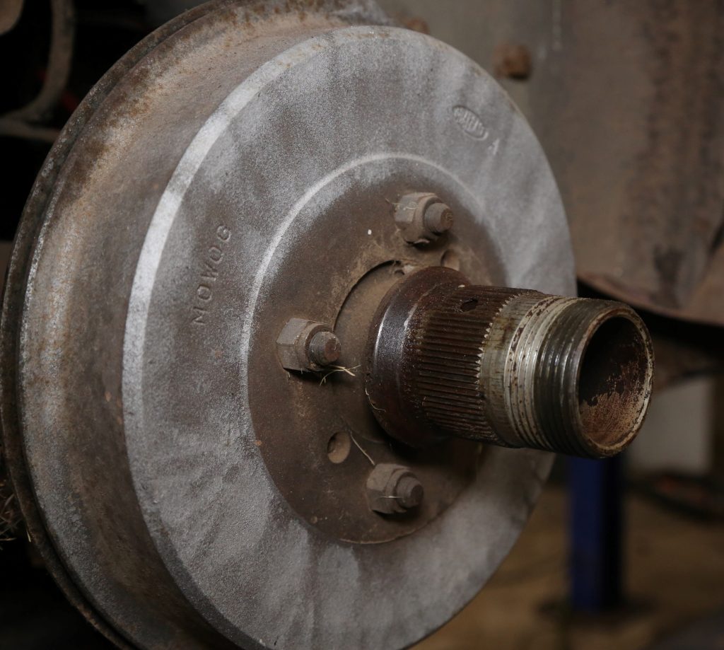 close up of a knock-off wheel threaded axle hub