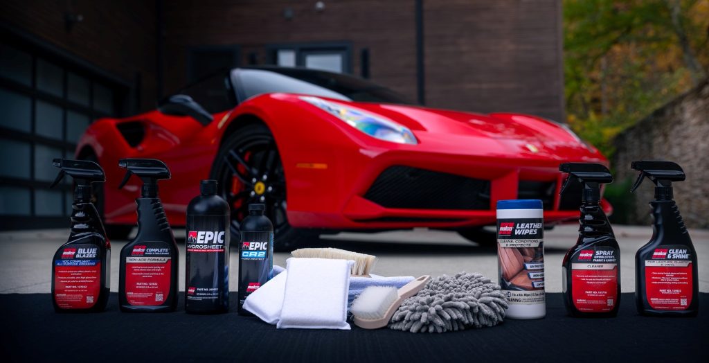 malco car cleaning products in front of a c8 corvette