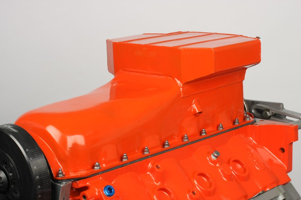 orange oil pan on an upside down v8 engine