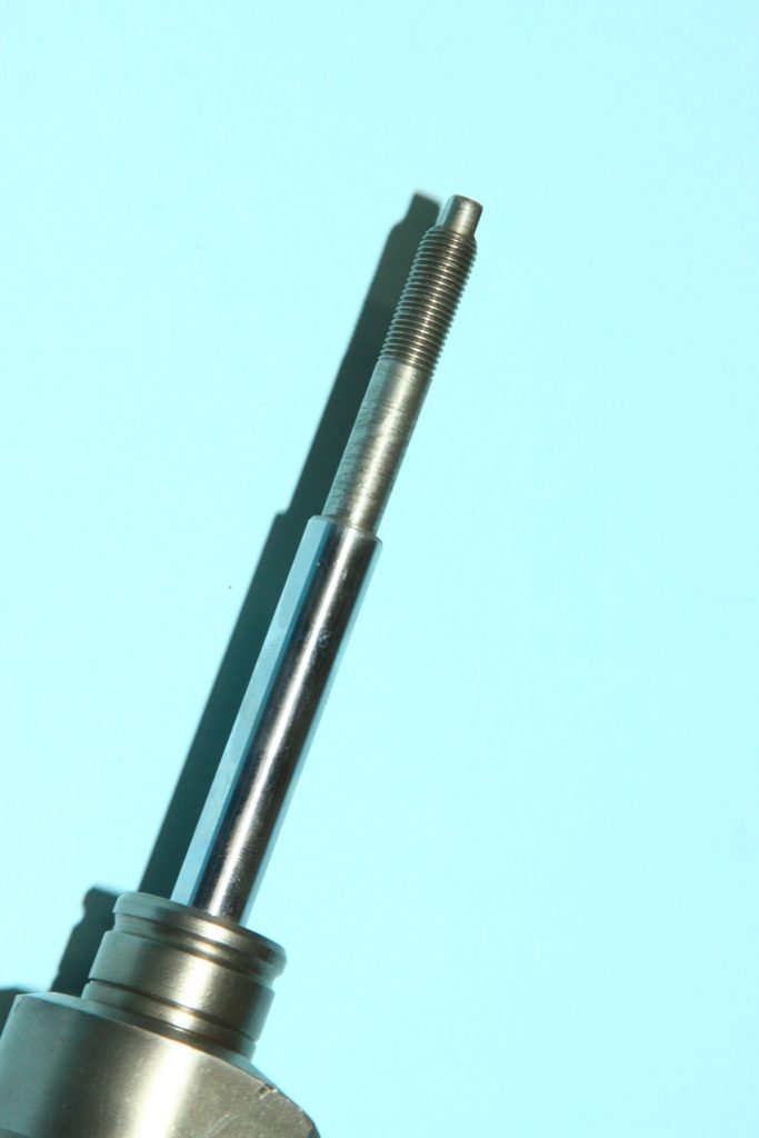 threaded piston shaft on a power steering cylinder