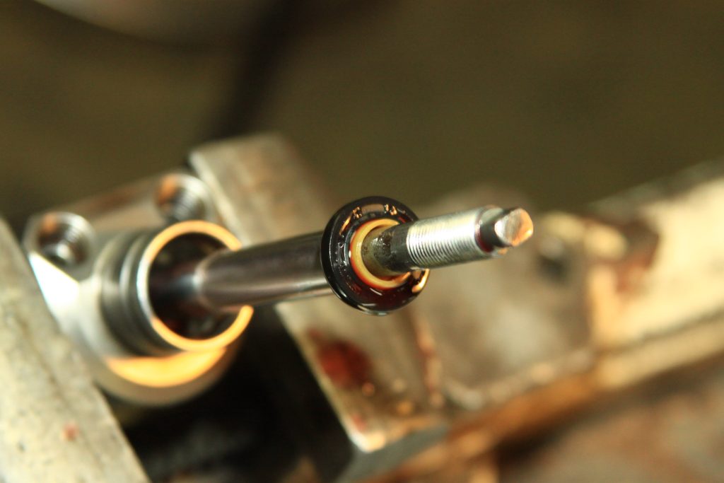 threaded piston shaft of a power steering cylinder